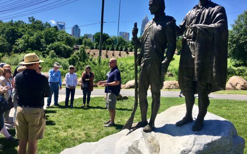 Statues near Seventh Street depict Thomas Spratt, left, and his friend, the Catawba Indian Chief known as King Haigler. Scott Syfert led a May 7 City Walk describing the statues and the people depicted, part of the Trail of History on one section of the Little Sugar Creek Greenway. Photo: Mary Newsom