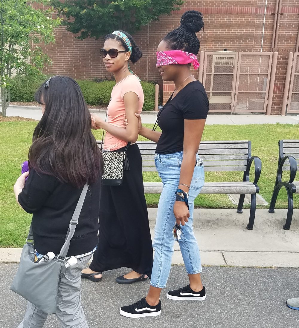 Participants experienced life in Charlotte as a visually impaired person during the Audible City Walk. Photo: Angelique Gaines. 