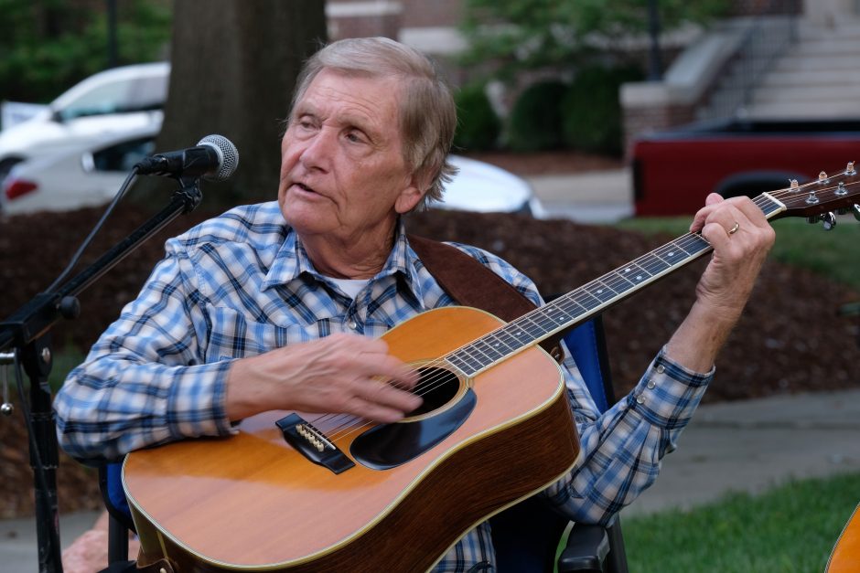 Musicians at the Bluegrass & Old-Time Jam Session on the square in Shelby, playing in front of the Earl Scruggs Center. Photo: Nancy Pierce.