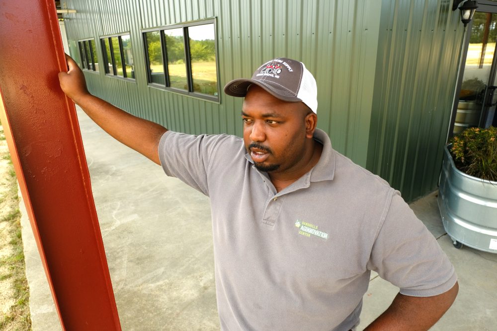 Davon Goodwin looking out over crops. Photo: Nancy Pierce