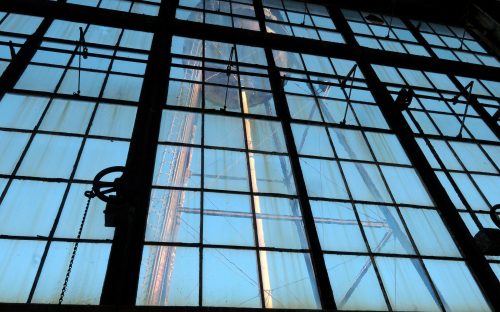 Visible through the boiler house's three-story-high windows is the old Ford plant's 92-year-old,100,000-gallon water tower.