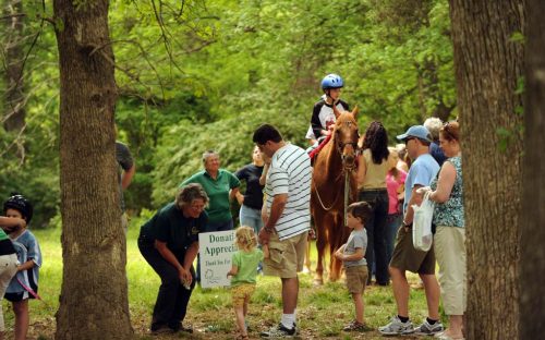 Children and adults gather near the Anne Springs Close Greenway in Fort Mill, S.C., April 2010.