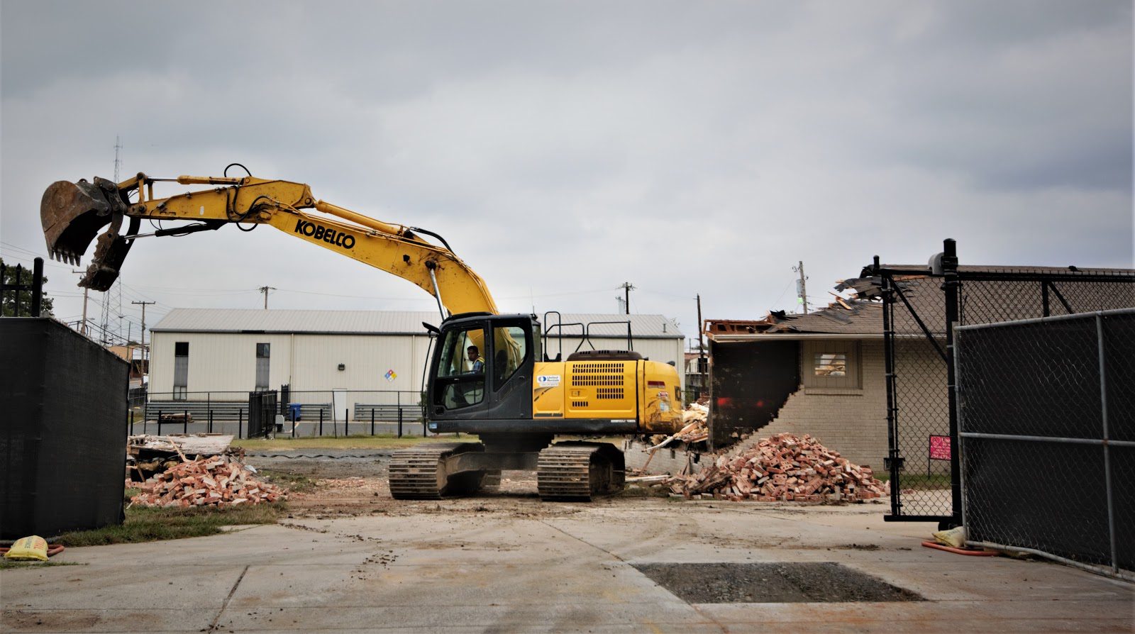 Construction equipment demolishing a building.