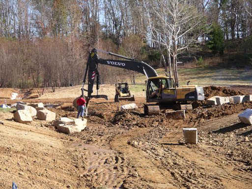 Digging the channel between the dam and Uwharrie River.