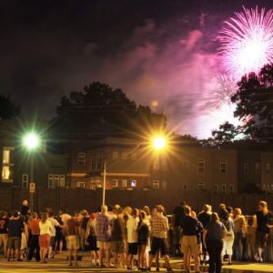 Crowd in Charlotte watches Fourth of July fireworks from the Hawthorne bridge.  