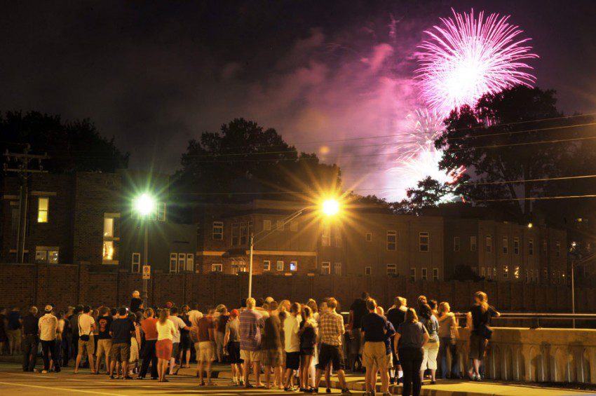 Crowd in Charlotte watches Fourth of July fireworks from the Hawthorne bridge.