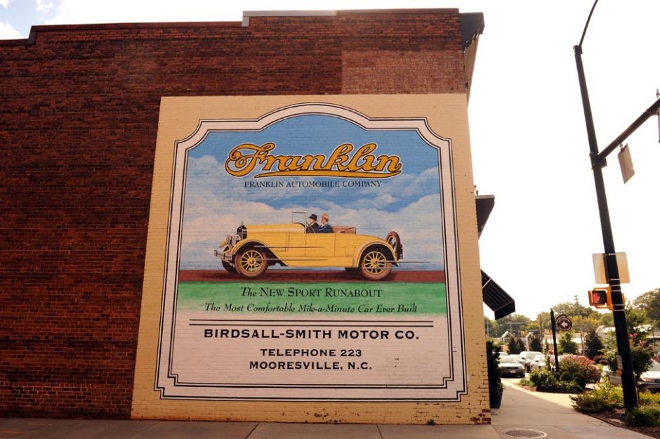 Sign on historic Mooresville building at Main Street and Center Avenue.