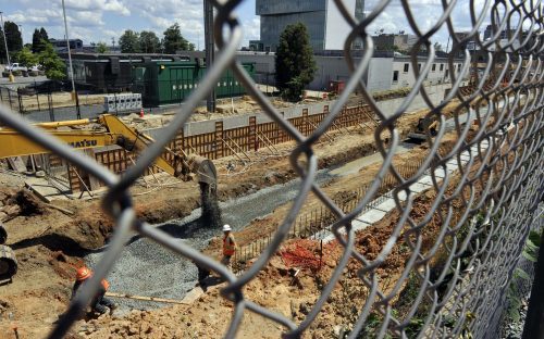 Workers pour walls for the foundation at the Blue Line Extension's Ninth Street Station uptown. Photo by Nancy Pierce.