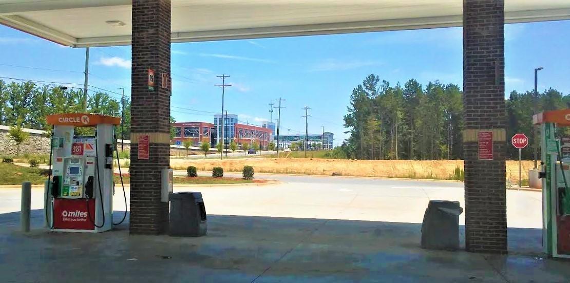 This Circle K has a view of a LYNX station platform and parking deck in the background. If Circle K were to shut down for a year or more, this parcel would have to conform to the new TOD zoning. Photo: Martin Zimmerman 