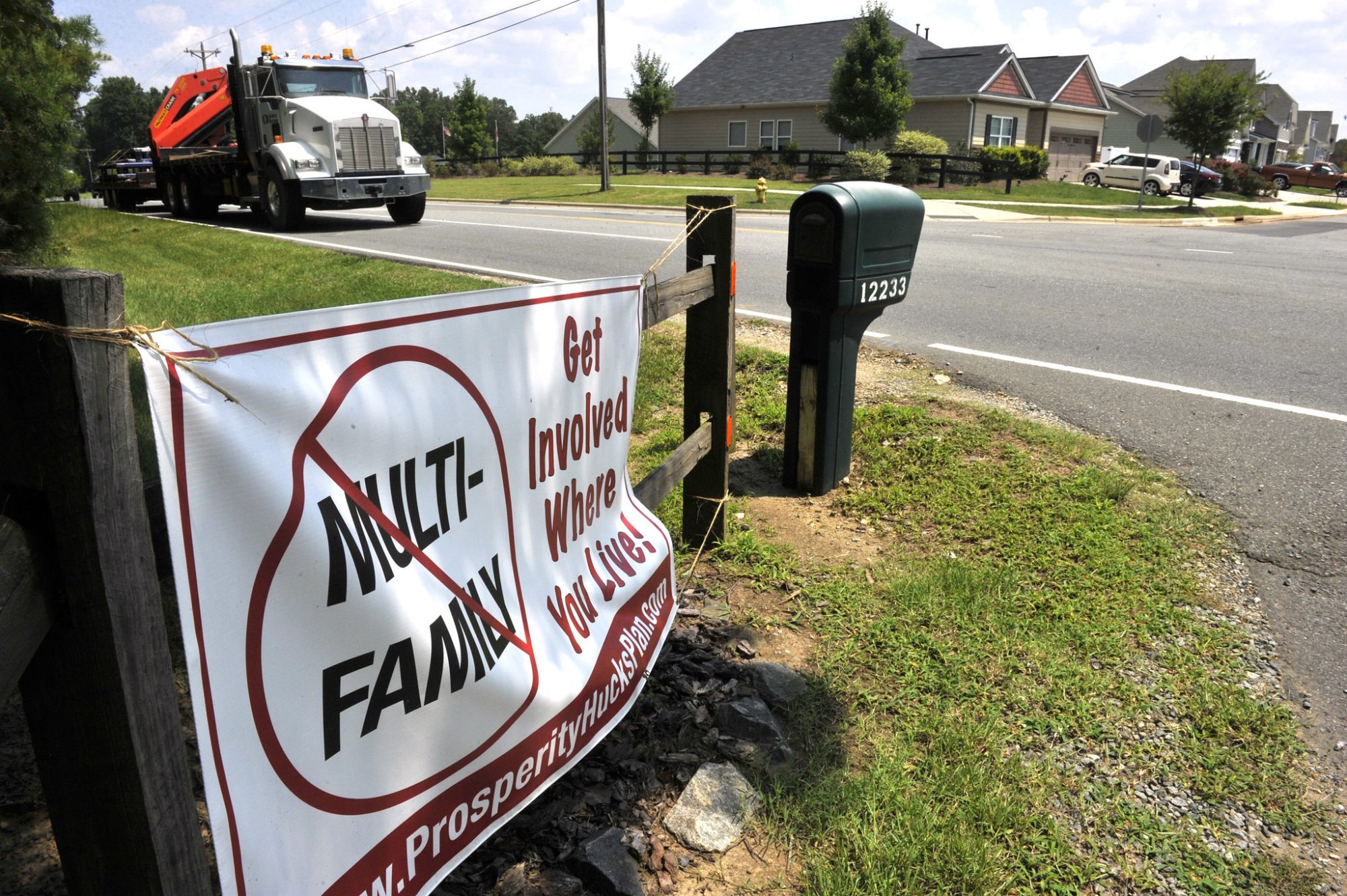 A sign that says No Multi-family housing