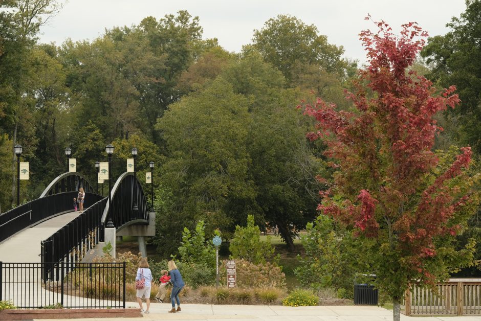 The bridge to Goat Island in Cramerton, with trails and greenways that are part of the Carolina Thread Trail system. Photo: Nancy Pierce.