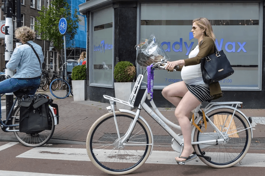 Pregnant woman biking