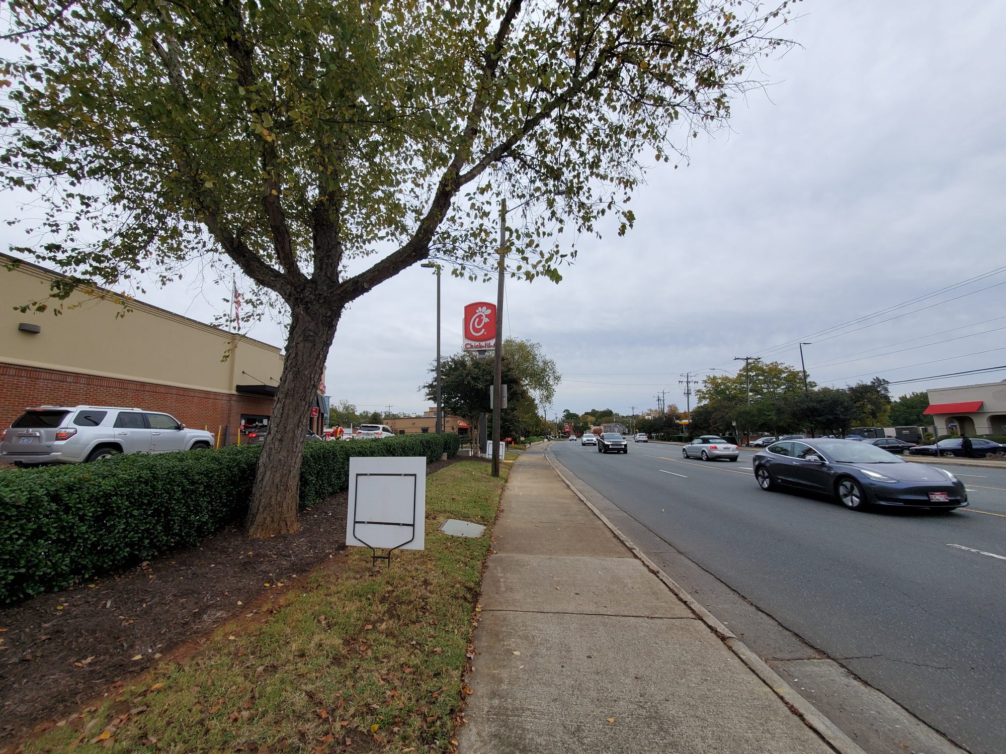 A Chick-fil-A beside a busy street