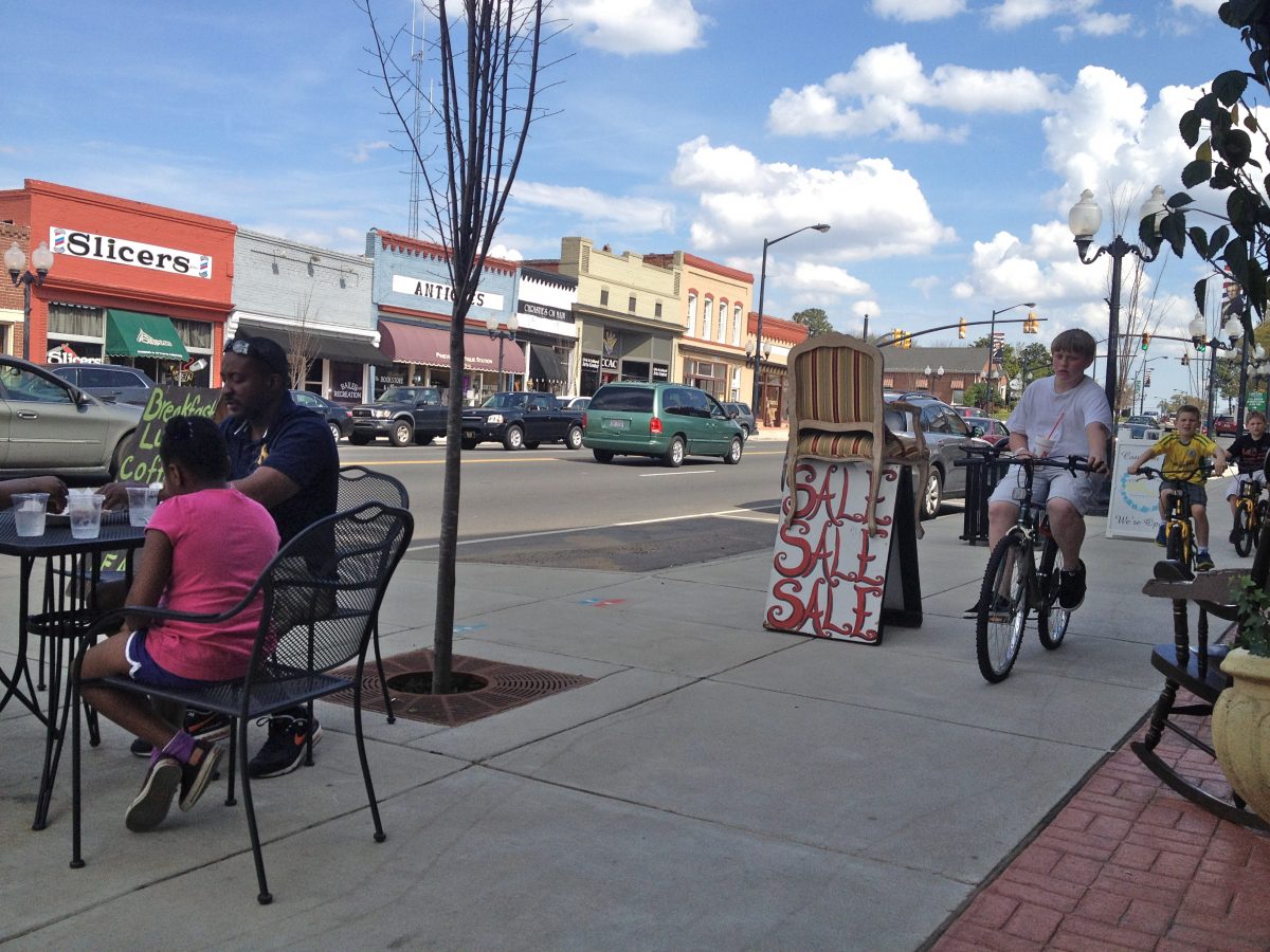 In downtown Pineville the sidewalks were filled with stores spilling out their wares and places to sit.