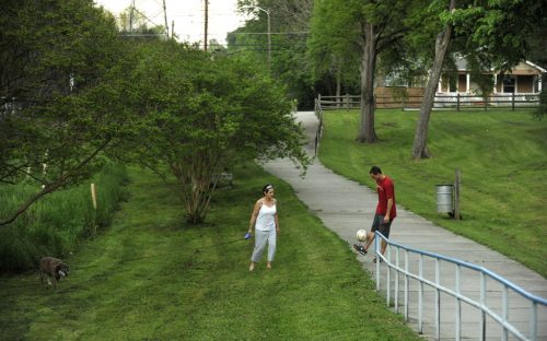 Barbara Harlow and son Robert Smith along the Little Sugar Creek Greenway in Charlotte's Belmont neighborhood in April 2012.