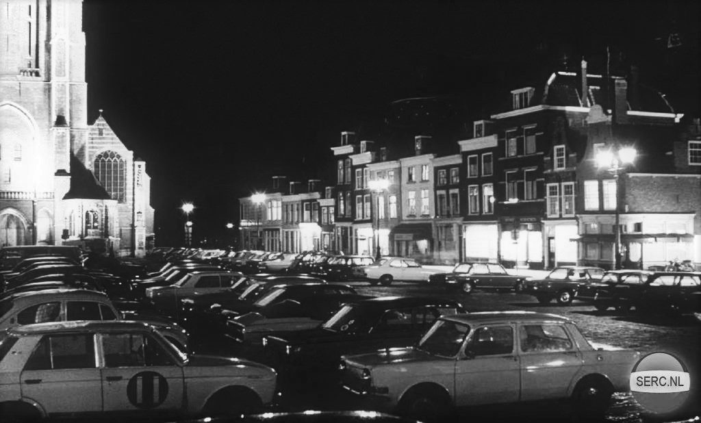 A plaza with cars parked there