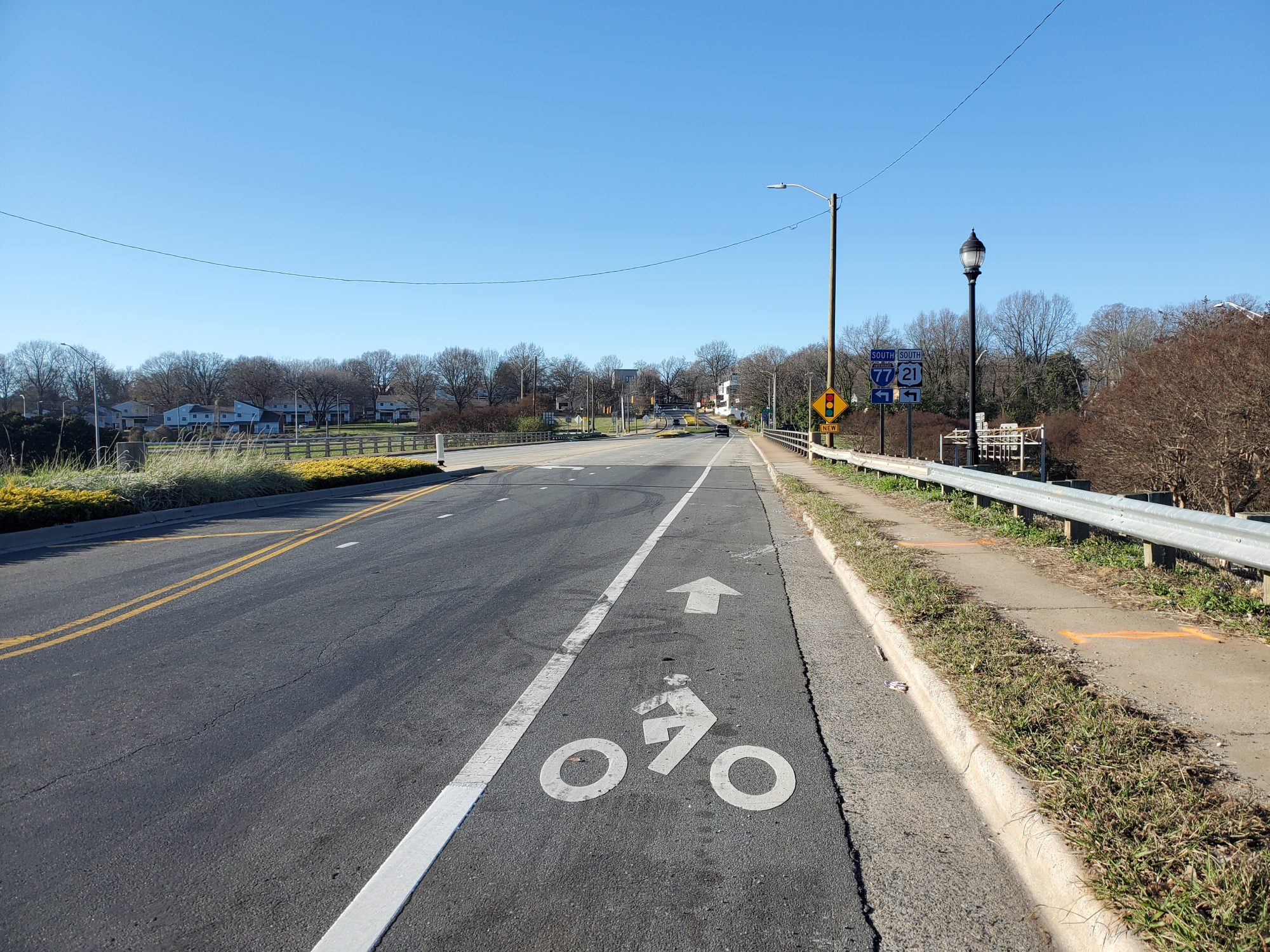 A painted bicycle lane on a road's shoulder